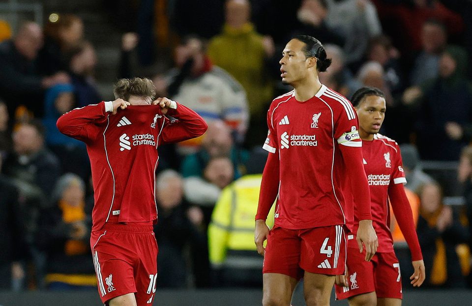 Liverpool players show their disappointment after conceding Wolves' injury-time winner